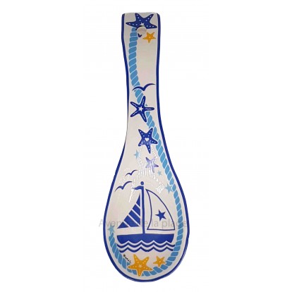 Repose cuillère voilier et étoiles de mer