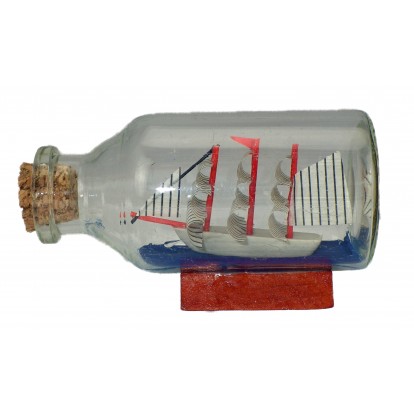 Maquette voilier dans une bouteille en verre 7 cm.