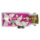 Magnet bouteille de sable rose et coquillages.