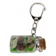 Porte clefs bouteille avec sable vert et coquillages
