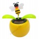 Plante solaire avec abeille qui se balance D